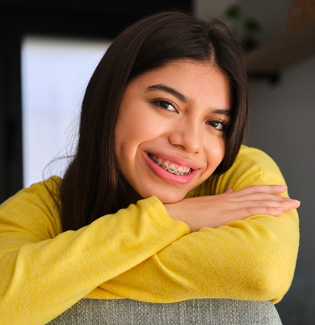 Young woman smiling after braces treatment